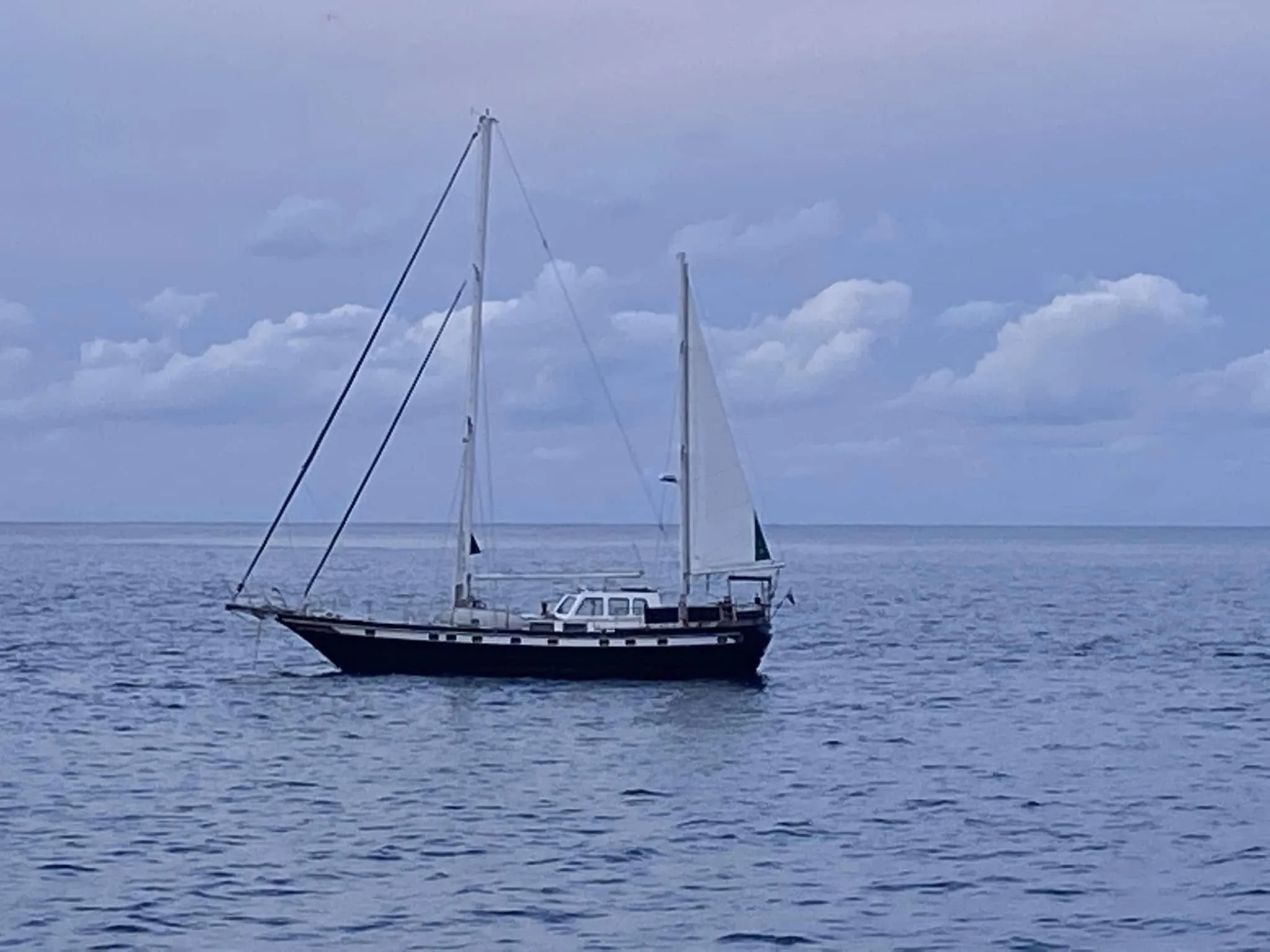 Sea Dragon at anchor under a blue evening sky