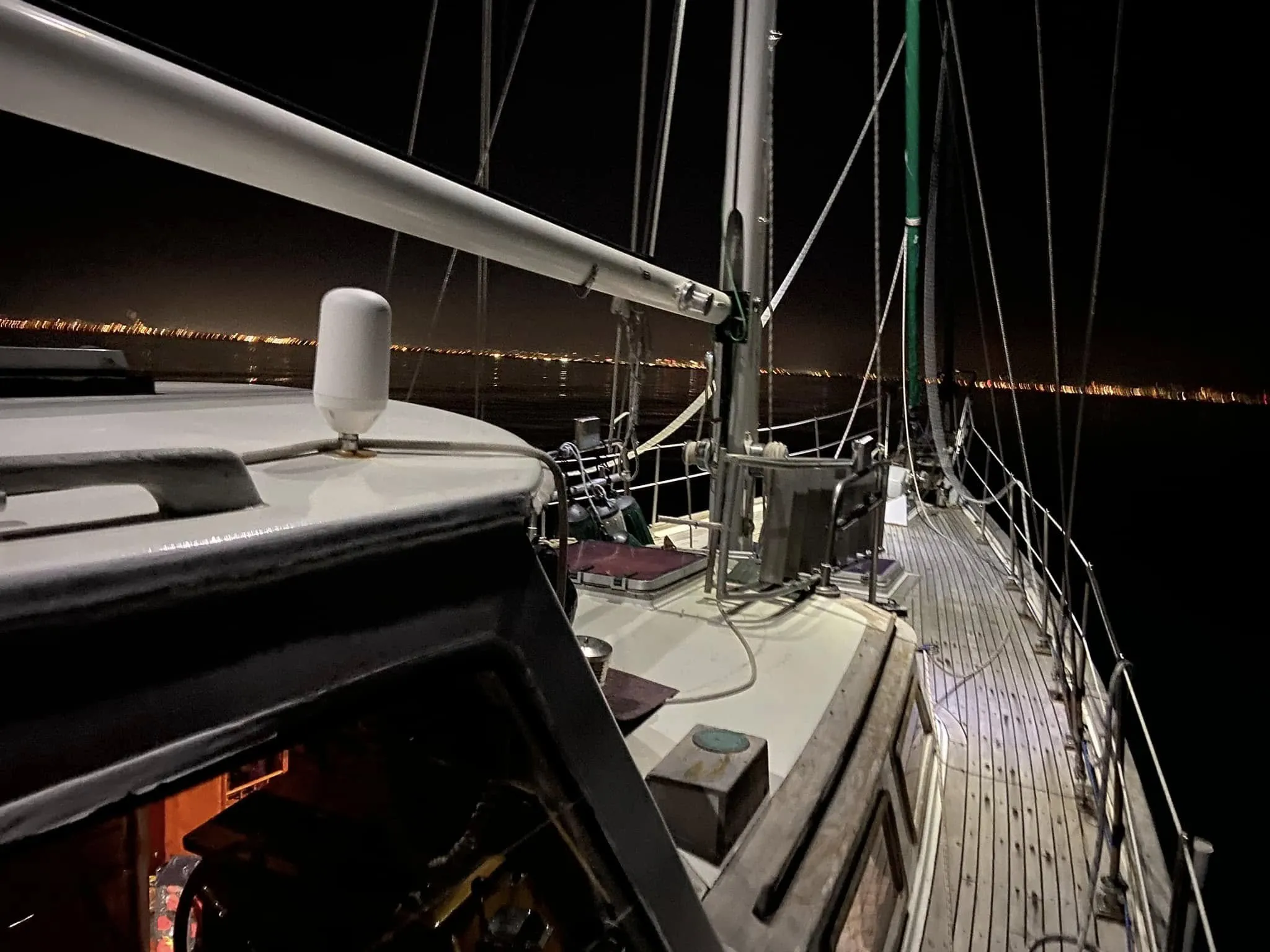 Sea Dragon's teak deck and rigging at night
